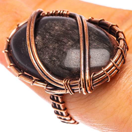Oxidized copper wire-wrapped jet oval ring with crisscross bands