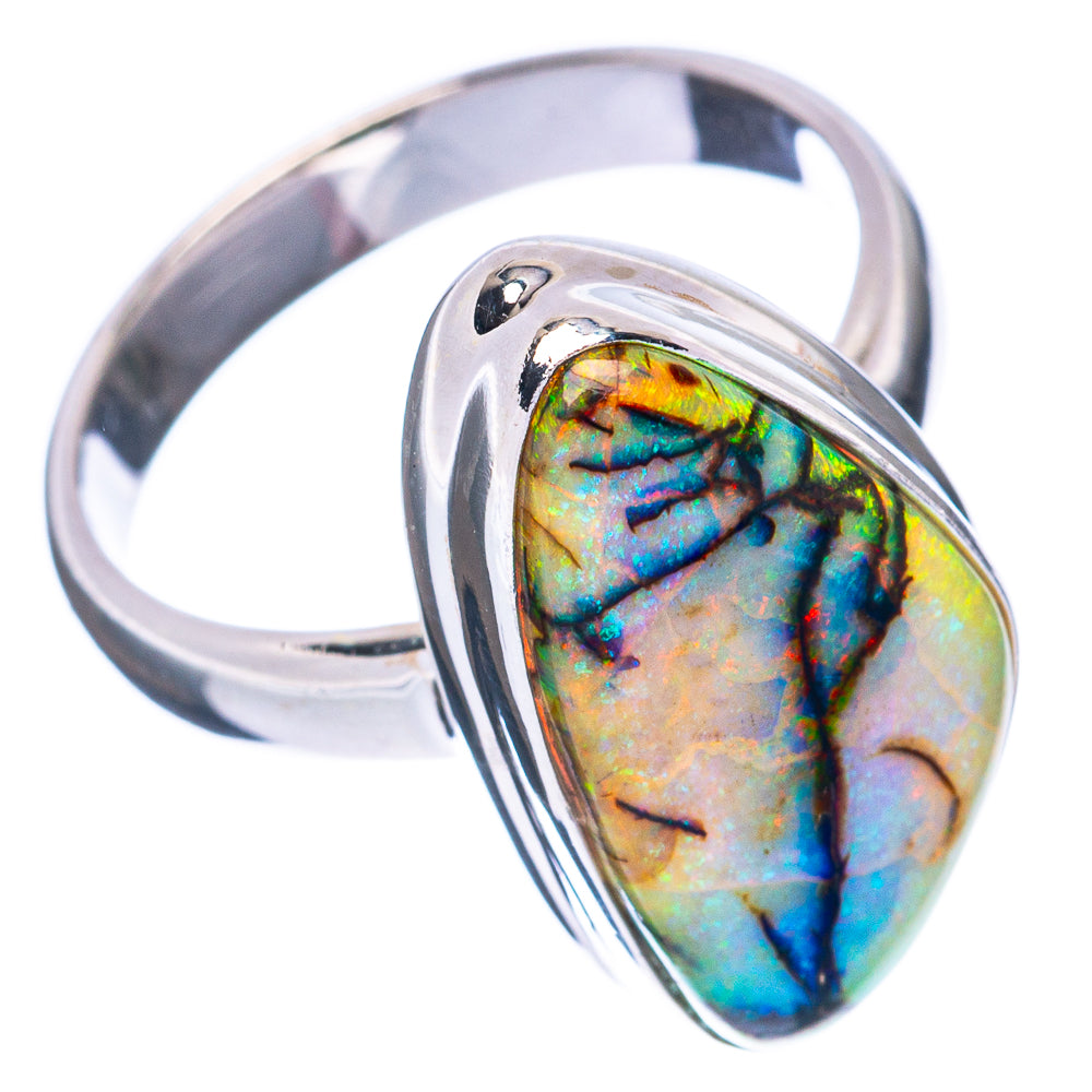 Sterling silver opal ring, oval stone in reflective bezel with blue, green, gold flashes.