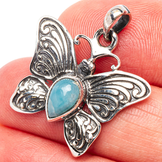 Aquamarine butterfly pendant in .925 sterling silver with oval blue stone and loop bail