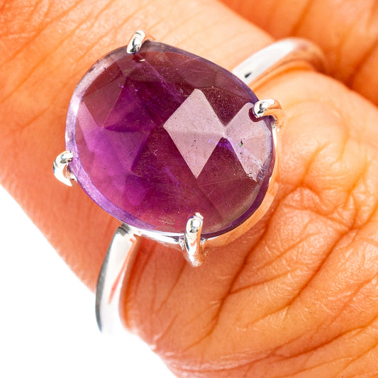 Faceted amethyst ring with oval gemstone and sterling silver prongs, size 6.75
