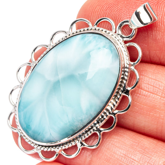 Larimar oval pendant in .925 sterling silver with scalloped frame and wire bail