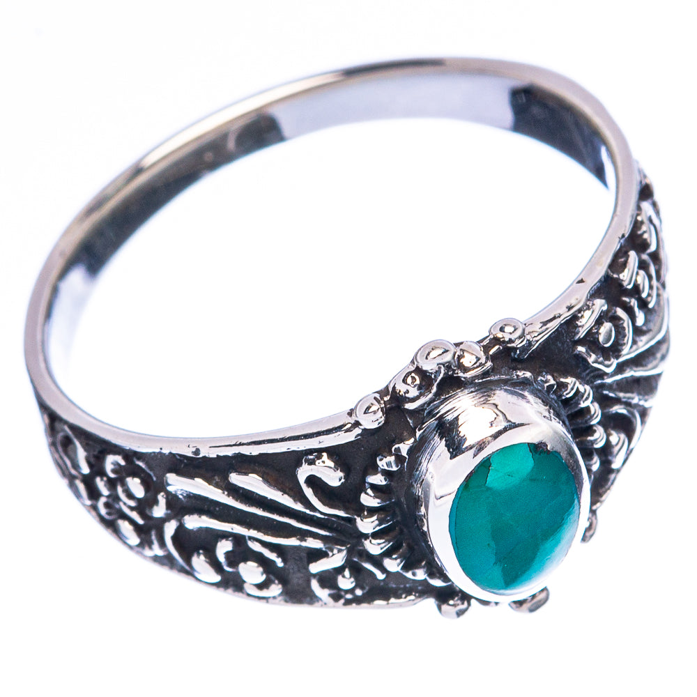 Sterling silver turquoise ring with oval green cabochon and detailed filigree sidework