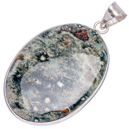 Oval jasper pendant in silver plating with green-blue speckled stone and hanging bail