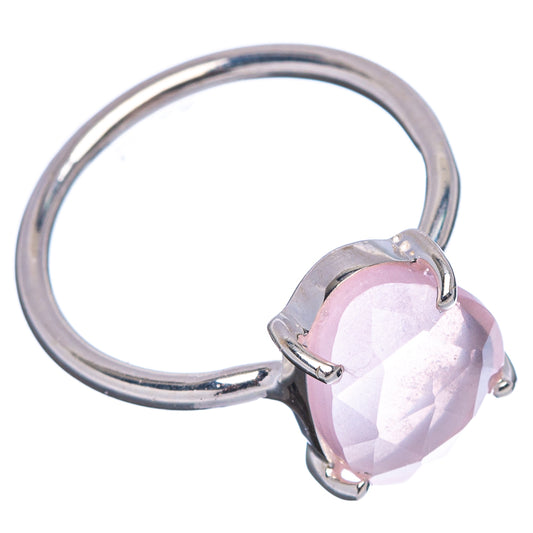 Faceted rose quartz ring with pink oval gem in silver bezel setting