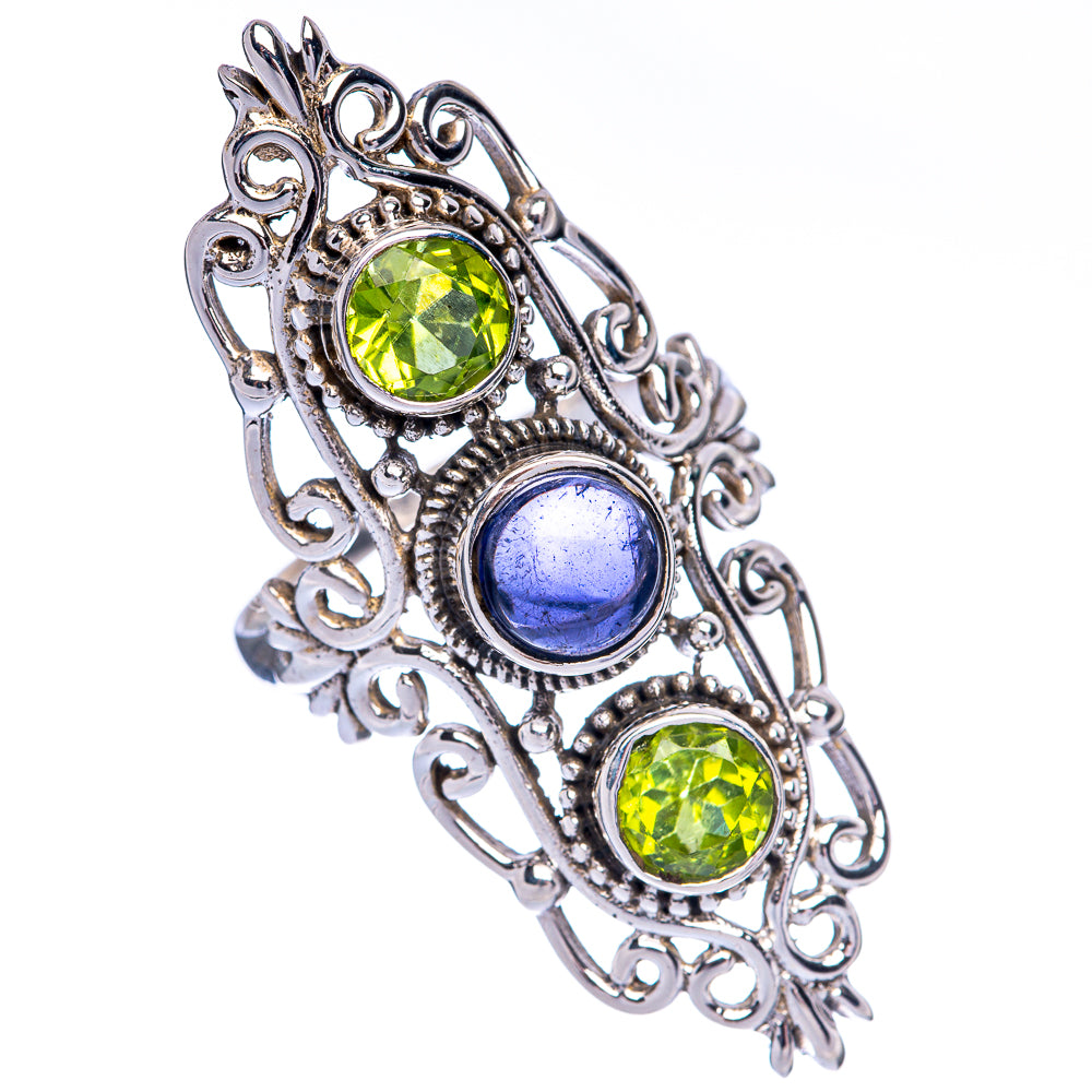 Ornate sterling silver ring with two round green stones and an oval blue gemstone