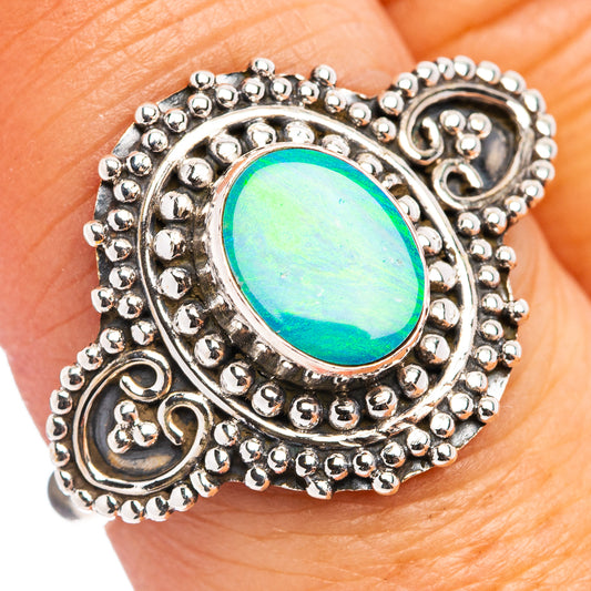 Opal inlaid sterling silver ring with oval green-blue gemstone and beaded filigree