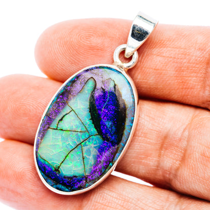 Oval opal pendant in .925 sterling silver with iridescent purple, blue, and green stone.