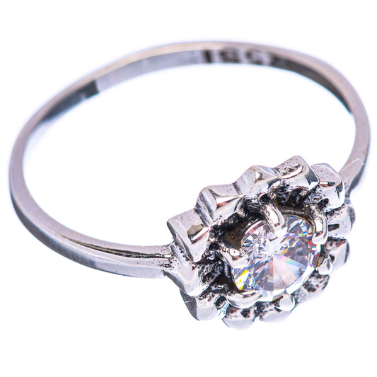 Sterling silver ring with round cubic zirconia center, raised halo of prongs