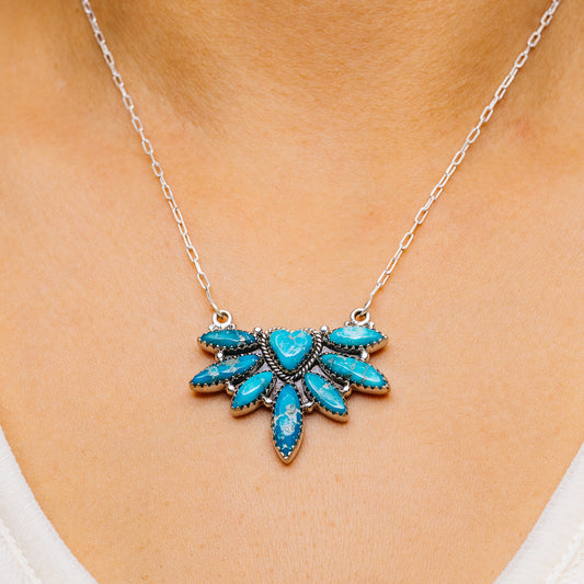 Turquoise sunburst necklace pendant with blue heart and teardrop stones on silver chain
