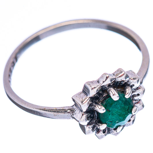 Sterling silver ring featuring a green gemstone centerpiece with raised prongs