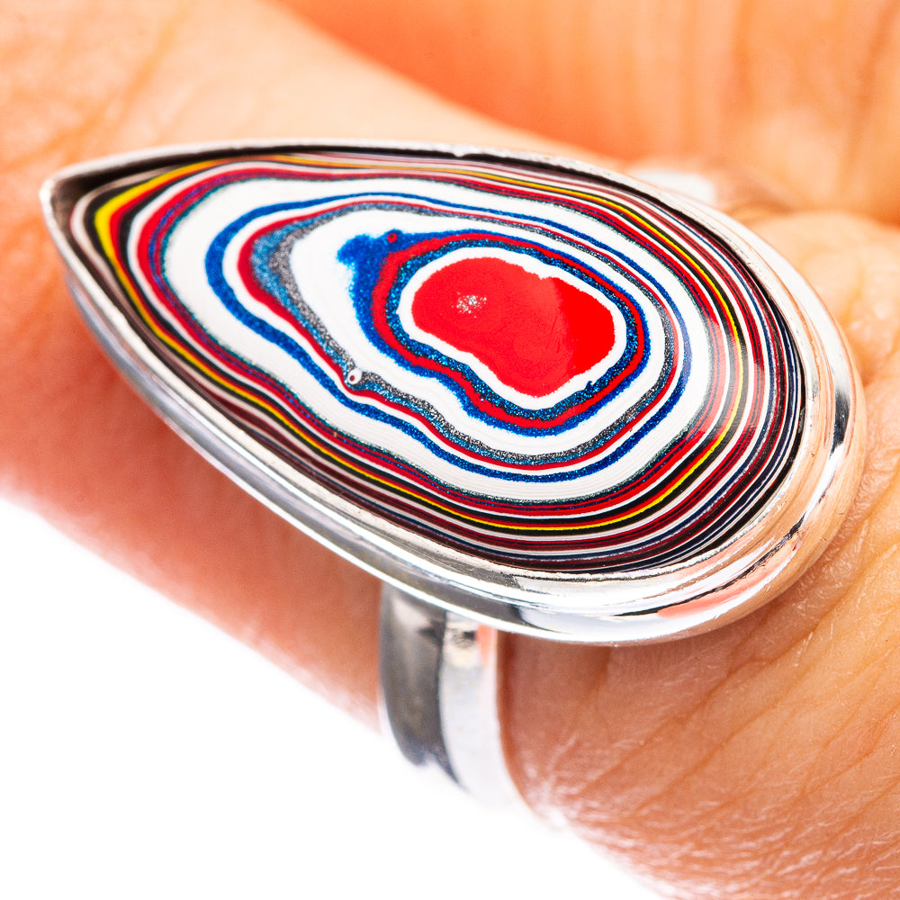 Sterling silver ring with colorful striped oval inlay and red center