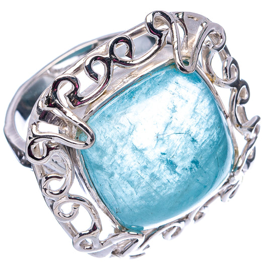 Sterling silver aquamarine ring with oval blue gemstone, ornate openwork setting