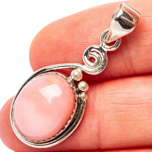 Pink opal pendant in .925 sterling silver with oval pink cabochon and ornate bail
