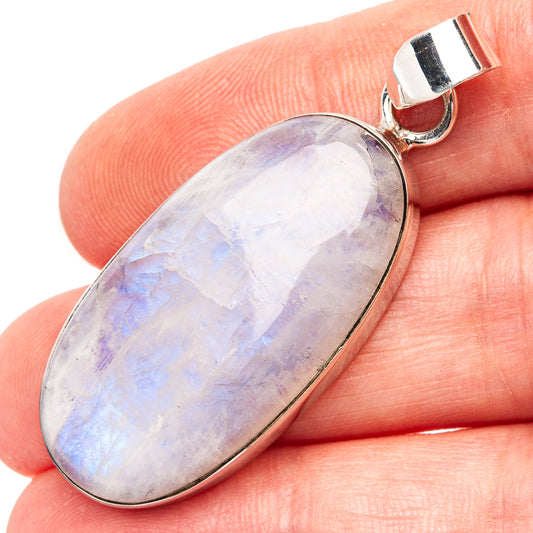 Oval rainbow moonstone pendant in .925 sterling silver bezel, loop bail on top.