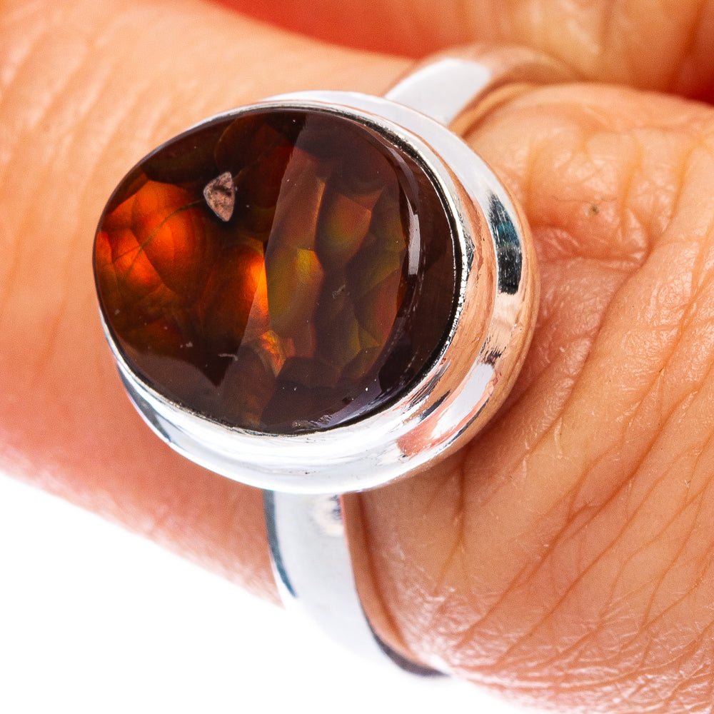Sterling silver oval fire agate ring with dark red-brown stone and orange flashes