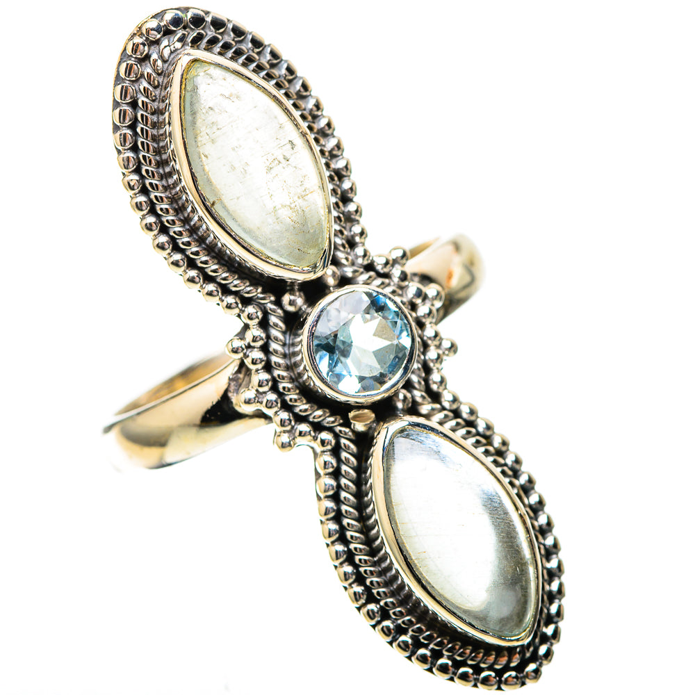 Sterling silver ring with two oval white stones and round blue center gemstone