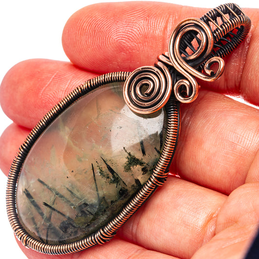 Oxidized copper wire-wrap pendant with teardrop prehnite stone, spiral details