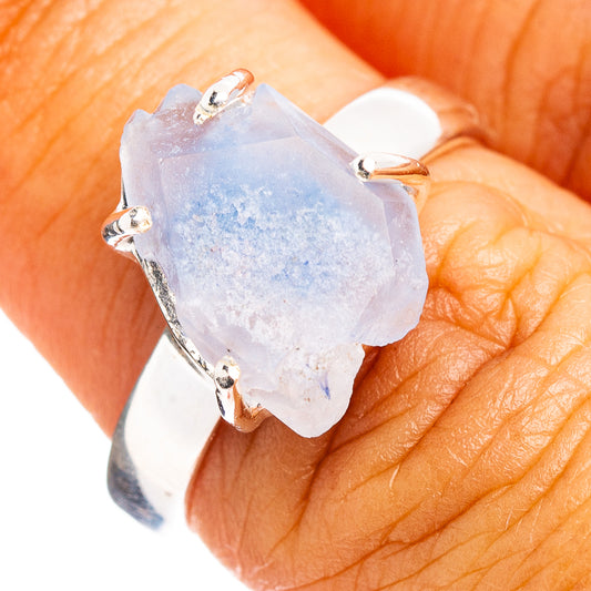 Sterling silver ring with faceted light-blue quartz shard center, claw prongs