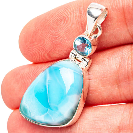 Sterling silver pendant with oval larimar-style blue stone and blue topaz accent