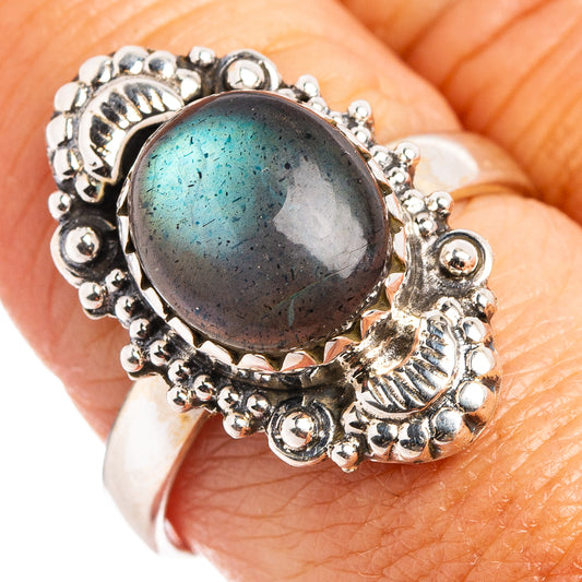 Sterling silver labradorite ring with oval blue-green gemstone and ornate beaded bezel