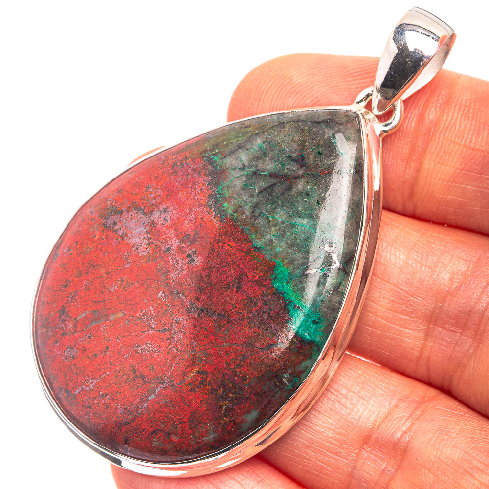 Sterling silver teardrop pendant with red, green and teal gemstone center