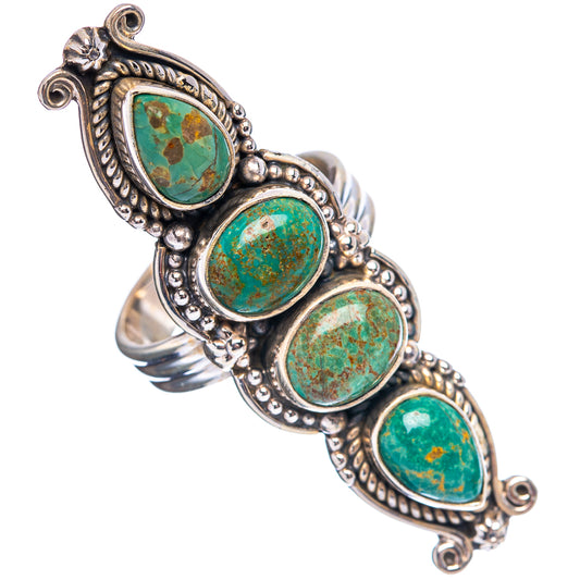 Turquoise oval cabochon ring with ornate silver bezel and connected side settings
