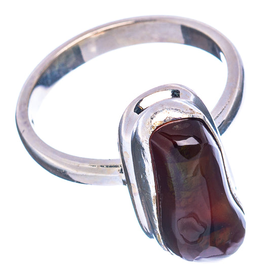 Sterling silver ring with raised oval fire agate cabochon, deep burgundy with highlights