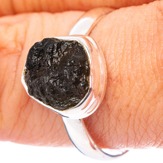 Sterling silver ring with faceted dark charcoal gemstone bezel
