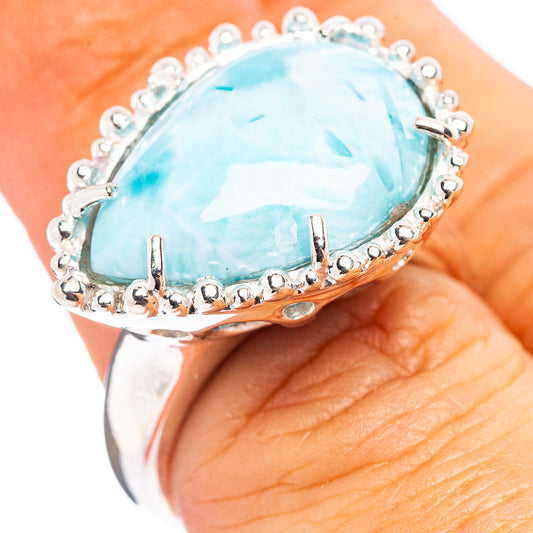 Sterling silver larimar ring with oval turquoise-blue gemstone and halo of small beads
