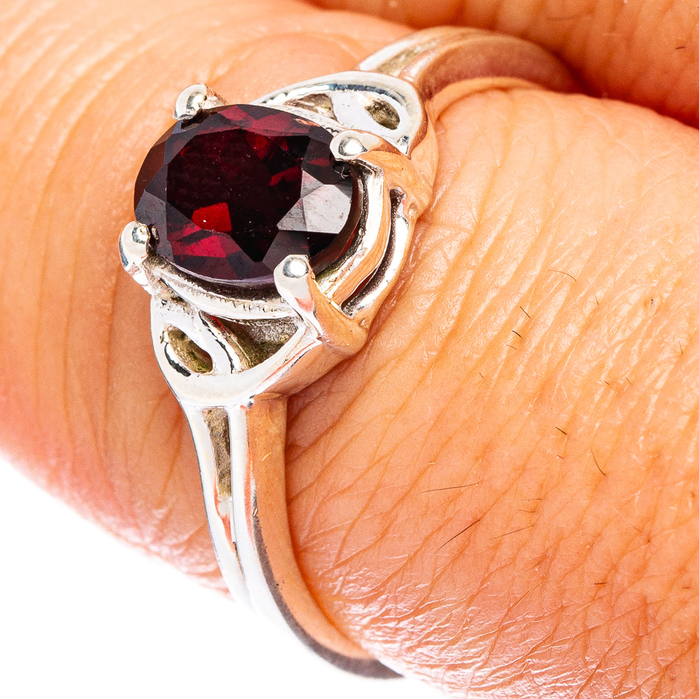 Sterling silver garnet ring close-up, size 8, faceted dark red stone, split bands