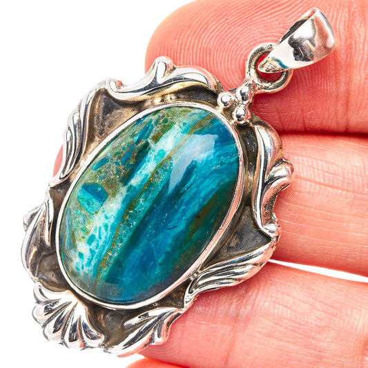 Oval blue-green opal pendant in ornate .925 sterling silver setting, with bail