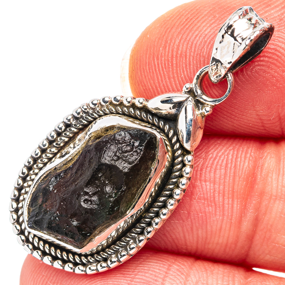 Sterling silver teardrop pendant with dark gray rough stone and loop bail