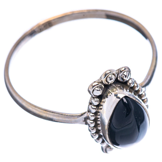 Sterling silver ring with oval black onyx stone, scroll and bead detail