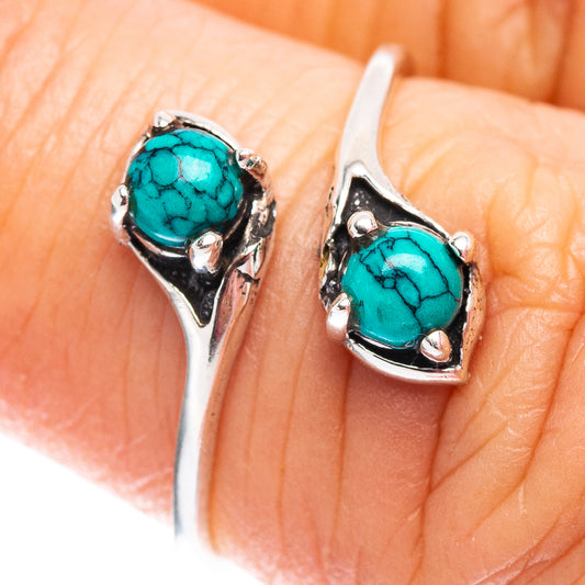 Turquoise cabochon ring in .925 sterling silver with ornate silver prongs