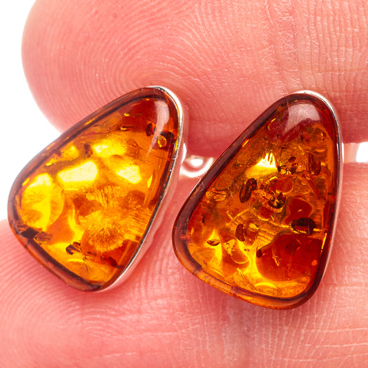 Amber teardrop stud earrings with .925 sterling silver frames