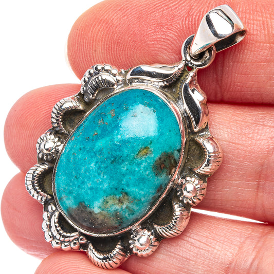 Oval turquoise cabochon pendant in .925 sterling silver with ornate bezel and bail