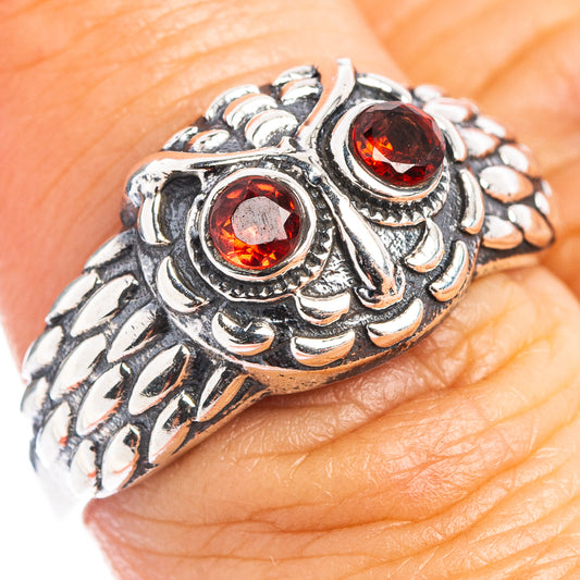 Sterling silver owl ring with two red round gemstones, ornate carved details