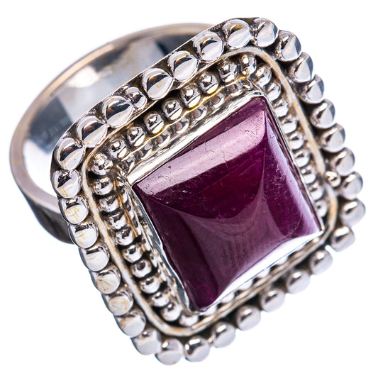 Sterling silver ring with square maroon gemstone, raised bezel and beaded edge, side view