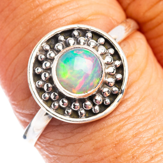 Sterling silver opal ring with round opal bezel and beaded halo setting