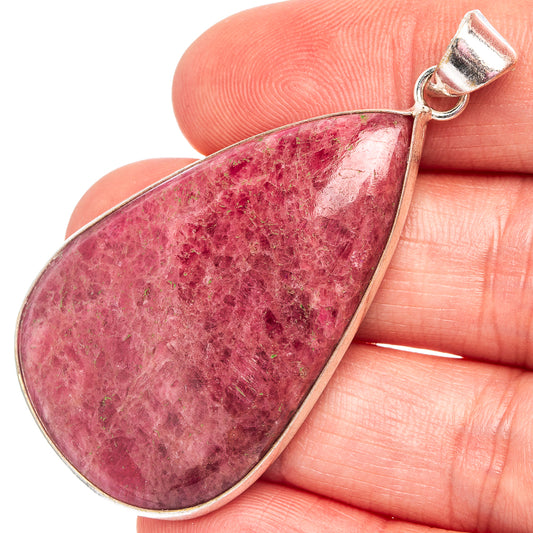 Rhodonite teardrop pendant with silver-plated bezel and pink-red speckled stone