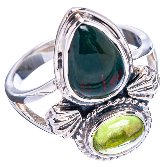 Sterling silver gemstone ring with dark green teardrop center stone and green oval side stone