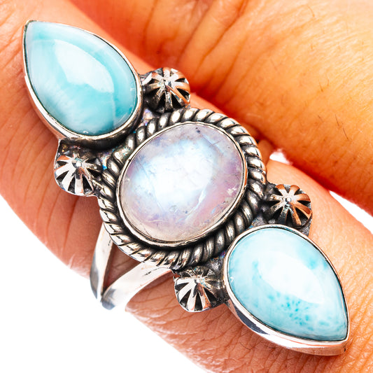 Blue teardrop and oval moonstone silver ring with three gemstones and ornate scrollwork