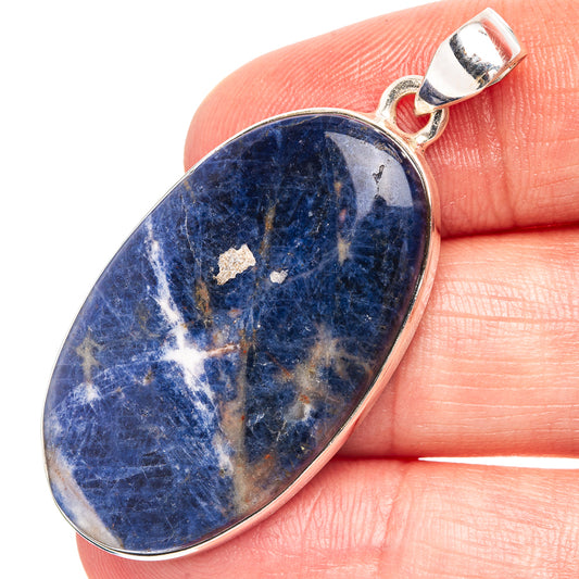 Oval blue sodalite cabochon pendant with .925 sterling silver bail and frame