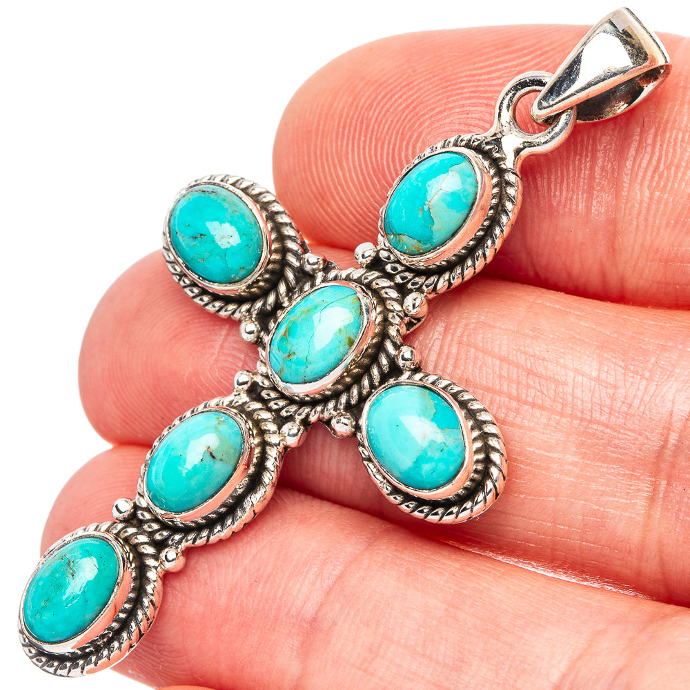 Turquoise cross pendant charm in 925 sterling silver with oval stones, close-up