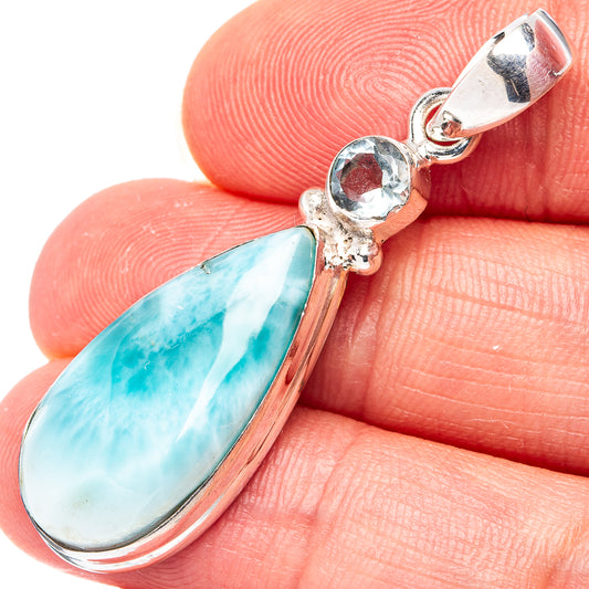Turquoise teardrop larimar pendant with blue round stone and silver bail.