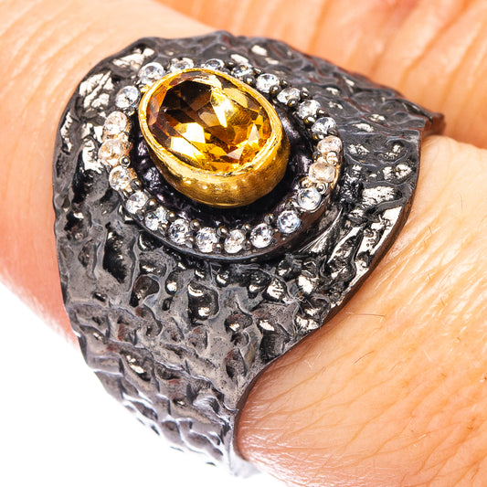 Black rhodium plated sterling silver ring with yellow citrine center stone and halo