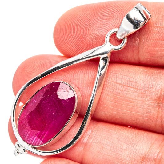 Sterling silver teardrop pendant with oval pink gemstone center, loop bail top