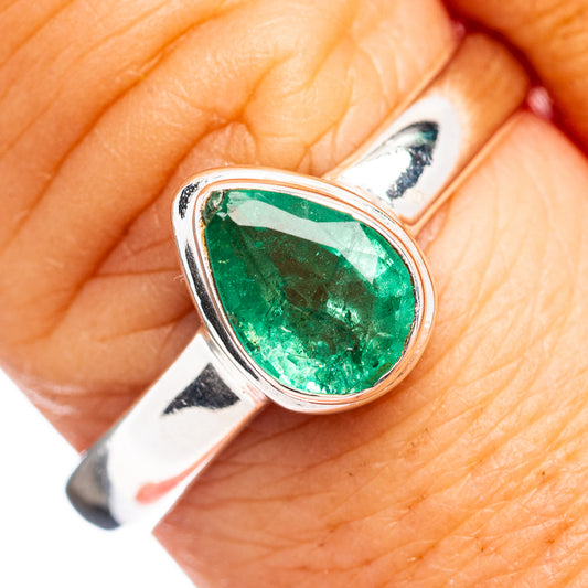 Sterling silver emerald ring with pear-cut green gemstone in teardrop bezel