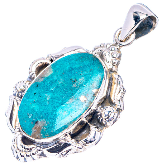 Turquoise oval gemstone pendant with ornate sterling silver setting and loop bail.