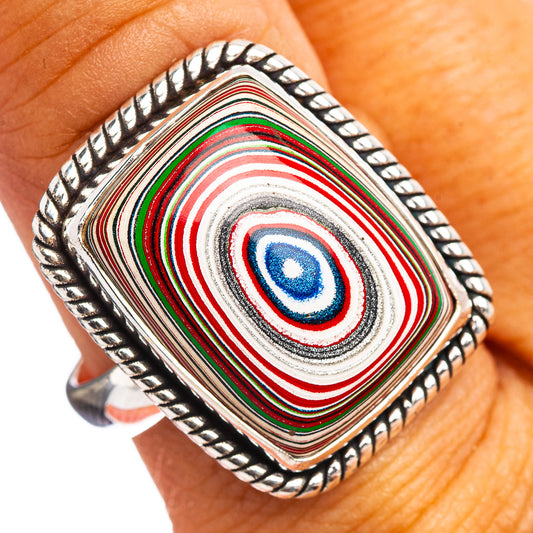Square sterling silver ring with colorful concentric-stripe inlay on hand